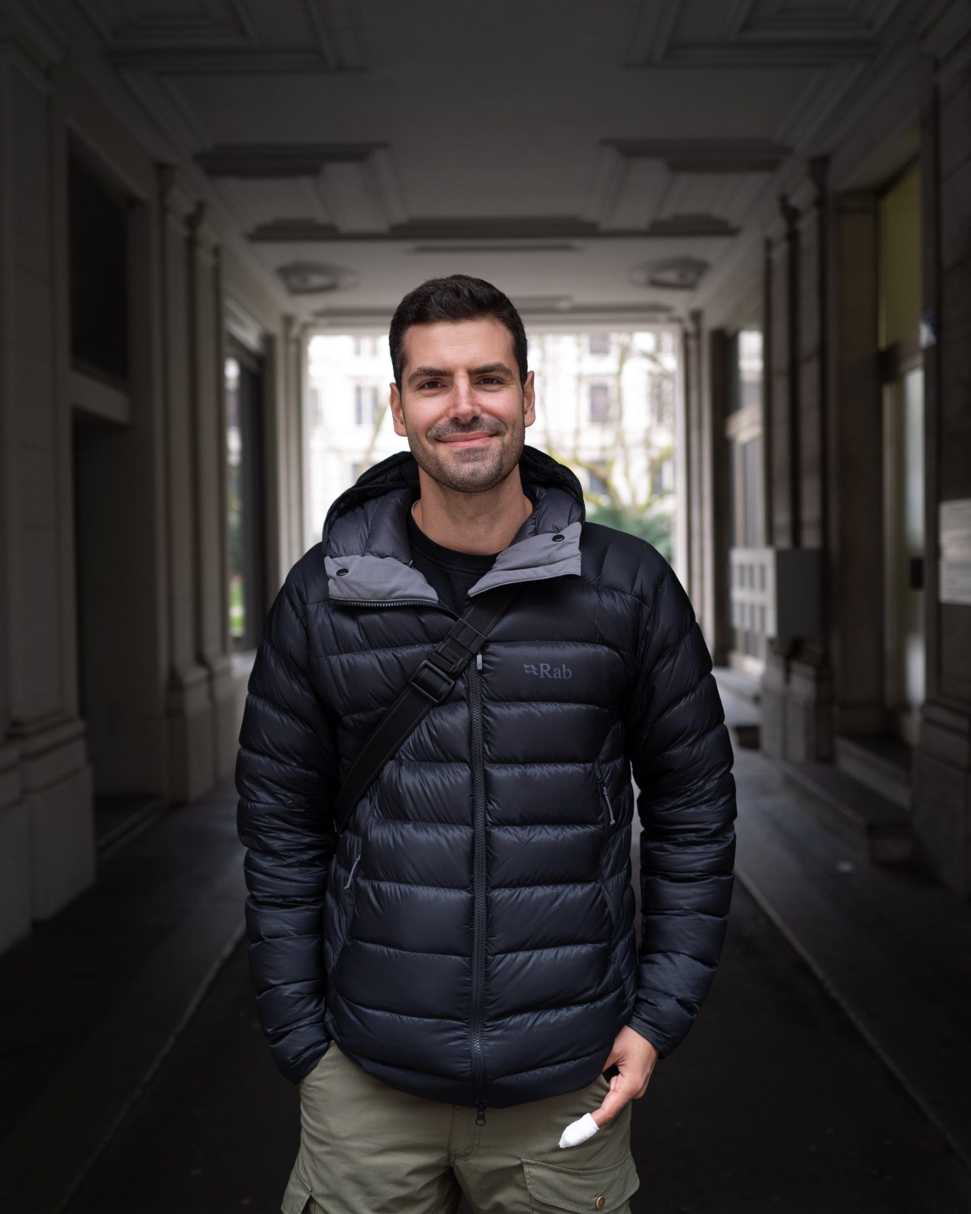 Alexis Darphin standing in a Zurich passageway